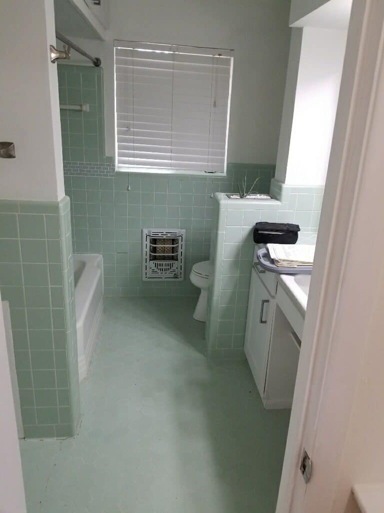 Bathroom repair with flooring, tile installing and bath installation